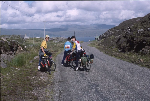 Graham, Andrew B and Jeremy near Fearnmore, 14 miles out, turning towards Loch Torridon beyond.