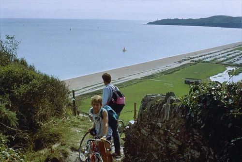 Mark and Paul Lakeman push up the steep coast path from Beesands towards Torcross, Start Point beyond.