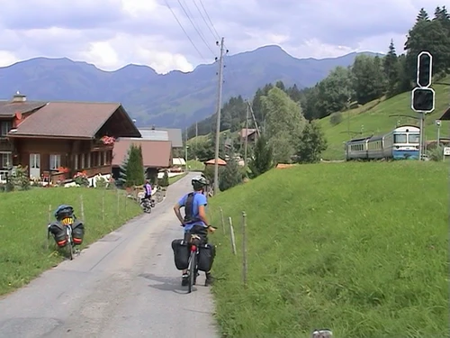 A train passes as we approach Oeschsette on our long descent. 15.7 miles in.