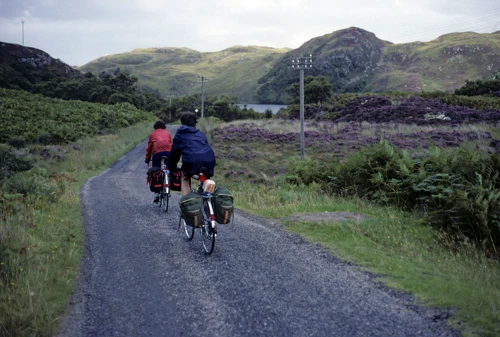 Andrew Brush and Jeremy roll on along the ‘Mad Little Road’, approaching Loch Buine Moire.
