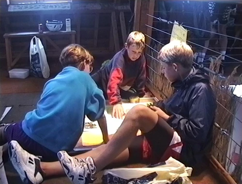 Tristan, Daniel and Peter T tackle a game at the Visitor Centre.