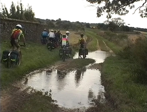 Muddy lake blocking the start of the three-mile Holgate Road from North Creek/South Creek to Stanhoe.