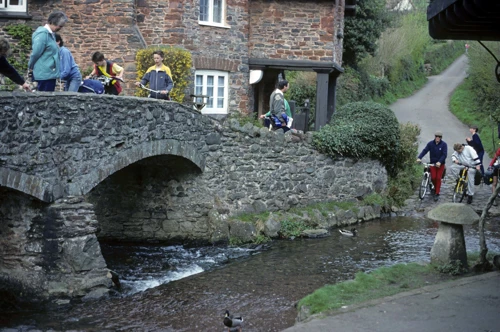 Mark S, Warren, Martyn and Simon weigh up the Allerford ford as the rest watch from the bridge.