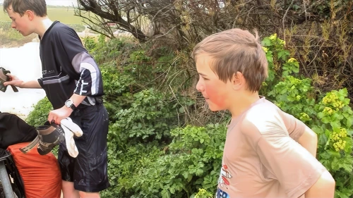 Soaked through, Joe and Josh roll on for the short hop to the hostel.