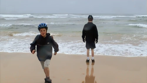 Beach fun at Constantine Bay as the promised 'dry day' starts dripping.