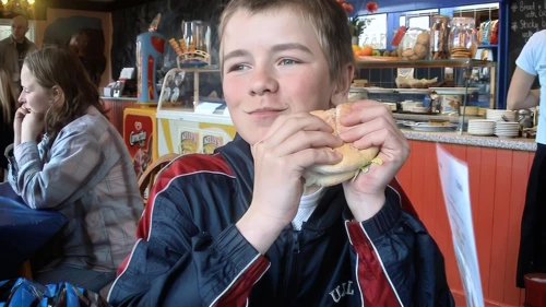 Josh tucking into a late lunch at The Atlantic Café, Portreath seafront.