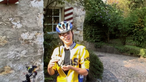 Joe finishes fitting his new speedo outside Brugg youth hostel.