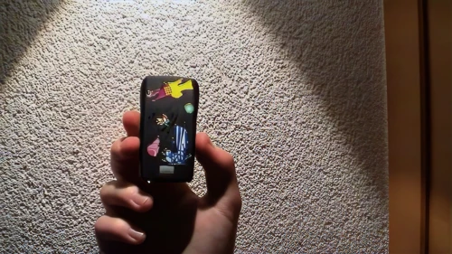 Joe shows off Nokia stickers—bought from a ‘girlie’ vending machine for half a franc.