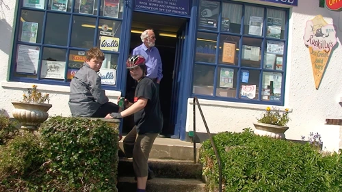 Soaking up sun and calm at Helford Village Stores and Post Office.