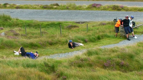 Ash rolls down the hill beside the memorial.