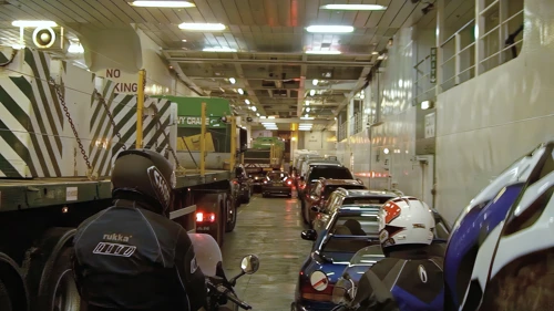 Disembarking at Ullapool; two enormous crane lorries dominate the central vehicle space.