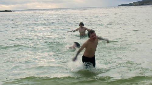 Swimmers spot a jellyfish at Achmelvich Beach.