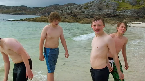 Four swimmers beat a hasty retreat at Achmelvich after spotting a jellyfish.