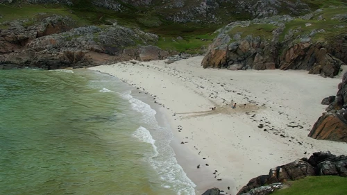 Sandcastle building slowly transforms Achmelvich’s second beach.