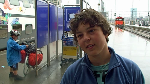 Lawrence at Zurich station—likes rain, but grateful for the train from Rotkreuz.