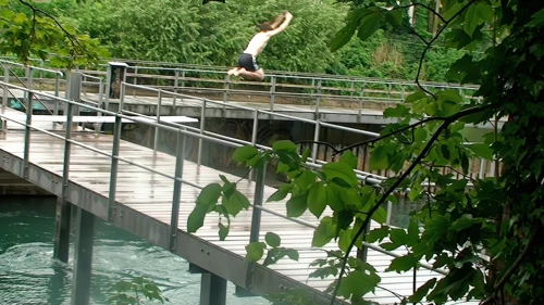 Ash sneaks a private jump at Zurich’s river swimming before letting us in.