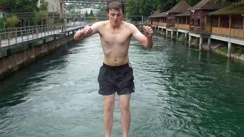 Ash throws another backflip into the river.