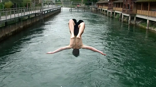 Ash fires off another backflip into the river.