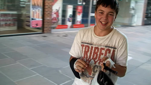 Outside Costa, Old George Mall, Lawrence recounts his Odstock spill and bandaged, grazed hands.