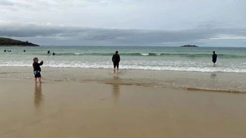 John captures the moment the icy Harlyn surf became irresistible.