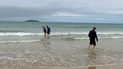Taking the plunge at Harlyn Bay.