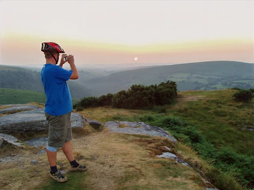 Gavin on Bench Tor as the sun sets beyond Two Bridges.