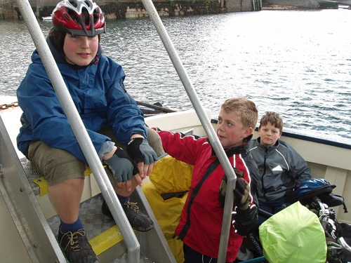 Zac, Sam and Ash on the eye-wateringly pricey 15:15 Falmouth–St Mawes ferry, 14.3 miles in.