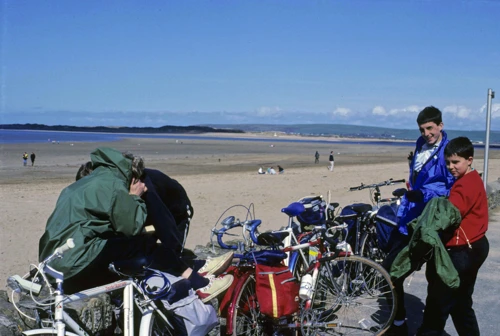 Neil and Ken Allan on Marine Parade, Instow, with beach and Taw estuary behind.