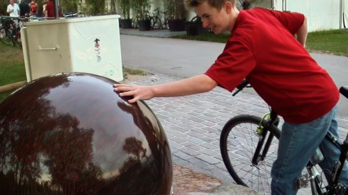 Joe spins the Ball Fountain by the lake in Zurich.