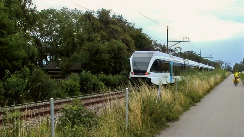 A train rattles by on Cycle Route 2 at Wiedehorn—37.2 miles in.