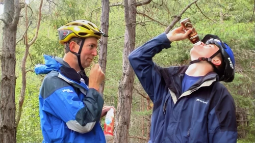 Michael coaches Joe on drinking Swiss yoghurt drinks near Rothenbrunnen.