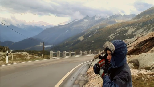 Joe zips up, bundled like an Eskimo, for the long descent from the San Bernardino Pass at La Smita.