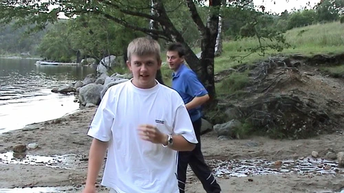 Tao and Gavin sprint from the midges on Revsvatnet’s shore, near the hostel.