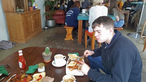 Dillan enjoys a vegetarian breakfast at the Green Pavilion Café, Buxton.
