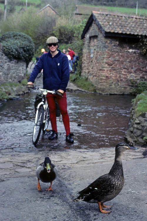 Mark Sloman emerges from the Allerford ford on foot, with slightly wet feet.