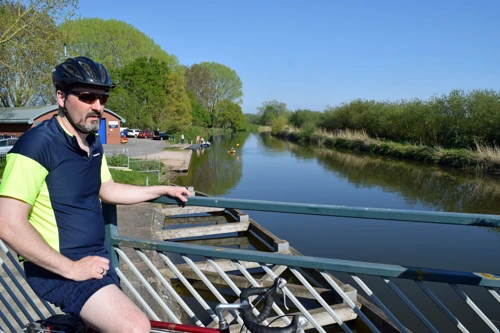 Tao at Countess Wear Bridge, Exeter, with the Exe Cycle Trail beyond