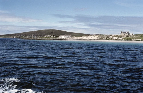 Thatched cottages near Rushgarry House by Baile’s silver sands, Berneray, from our ferry.