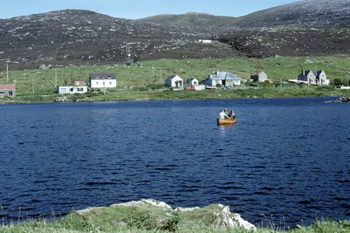 Boating on Leverburgh’s loch, Obbe Road behind, seen from near the village stores en route to the café.