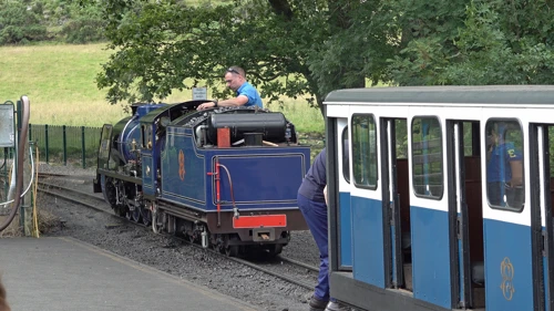 The miniature steam engine couples to the train at Dalegarth Station.