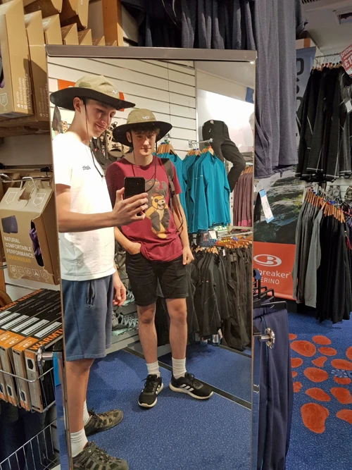 Tao and Jude try outfits in Gaynor Sports, Ambleside—probably the UK's largest outdoor store.