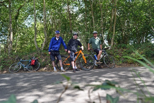 Michael, Dillan and Gavin pause at the top of Hembury Woods on the way home.