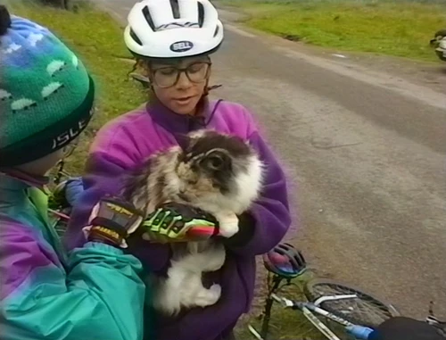 Lukas Wooller admires Mrs Fergusson's adorable cat outside her B&B in Milltown, Applecross.