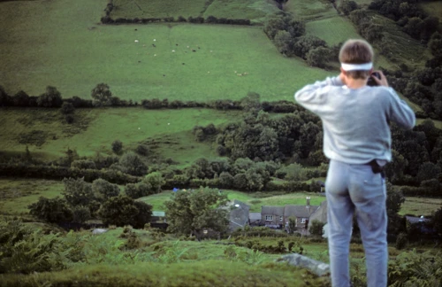 Brett photographs the hostel from Darren Lwyd during the evening hill walk