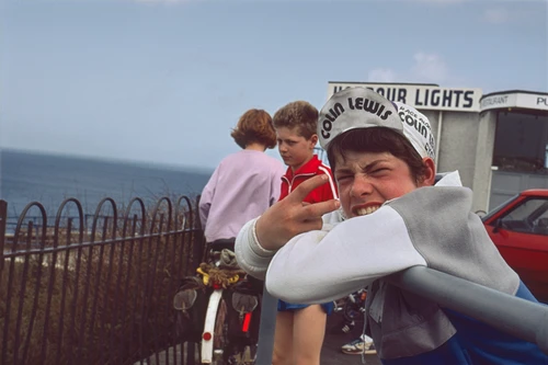 19 Apr 1987 · Gary, being Gary, flips two fingers outside the Harbour Lights Hotel, Polkirt Hill, Mevagissey. Warren disapproves; Catherine looks on.