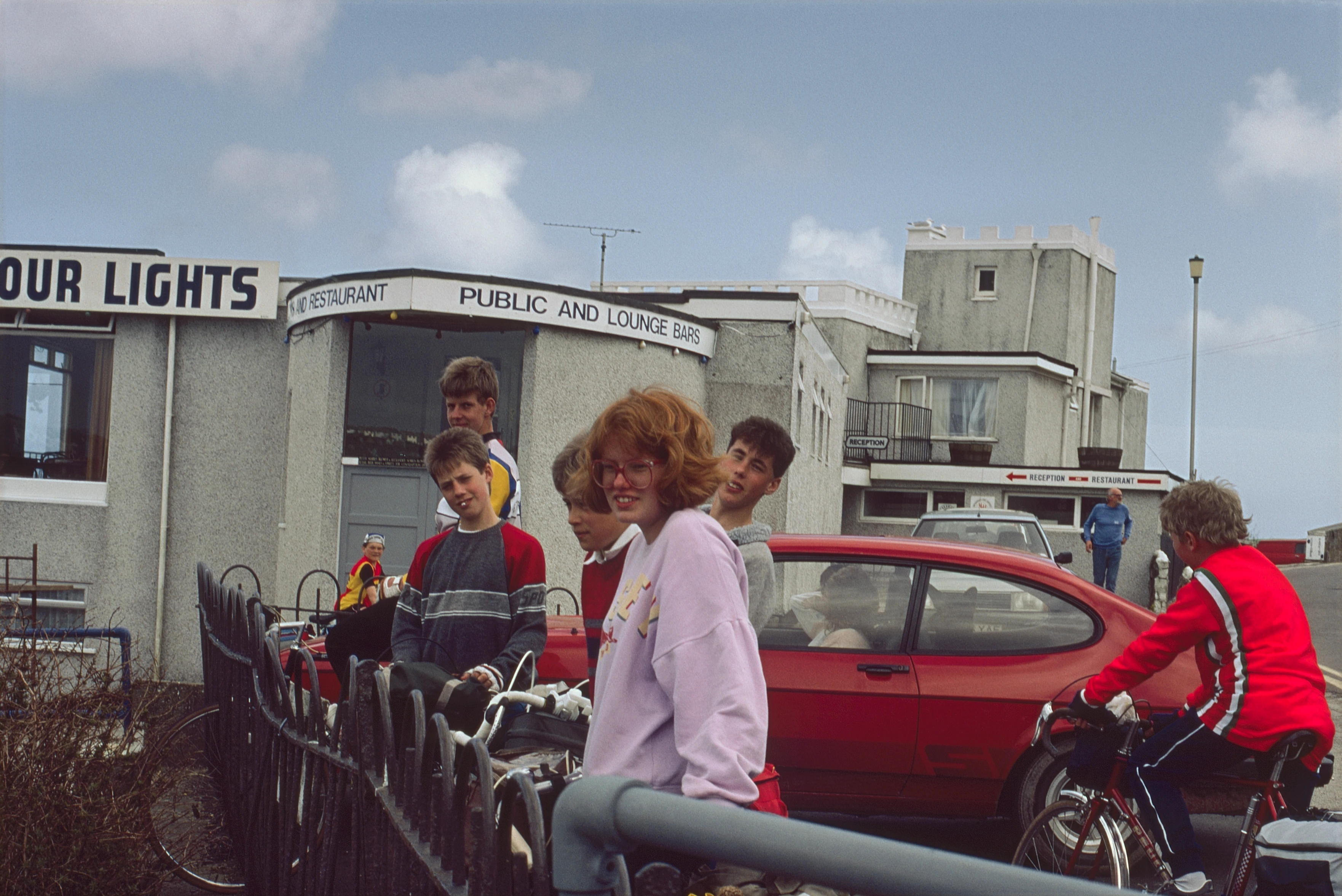 Jason, Mark, Brett, Philip, Catherine, Martin and Paul by the Harbour Lights hotel at the top of Polkirt Road, overlooking Mevagissey Harbour
