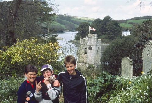20 Apr 1987 · Jason, Gary and Brett at St Just in Roseland, church and creek beyond.