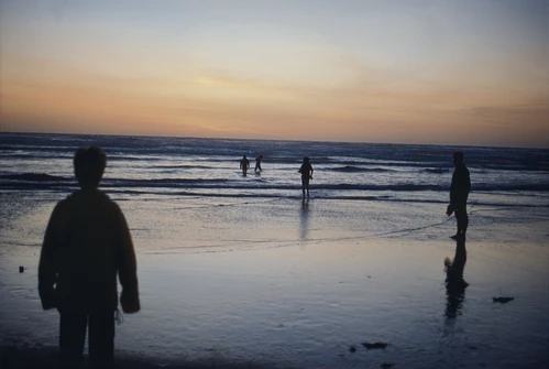 20 Apr 1987 · Wading the shallows at Perranporth as the sun goes down.