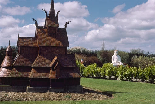 21 Apr 1987 · Fantoft Stave Church, Bergen, with the Great Buddha of Kamakura behind, at The World in Miniature.