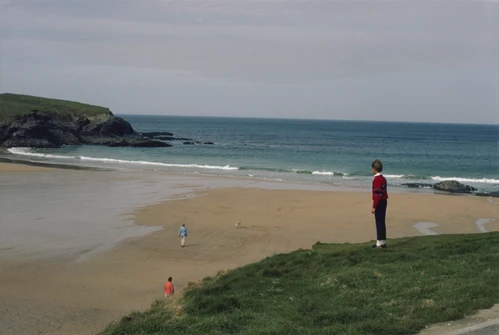 22 Apr 1987 · Philip Humphreys looks down on Treyarnon Bay beach from the high ground outside Treyarnon Bay Youth Hostel.