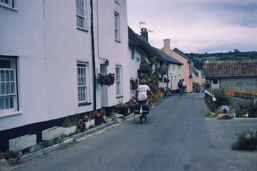 18 Jul 1987 · Richard Burge follows as we descend through lower Branscombe, near St Winifred’s Church. Still dry.